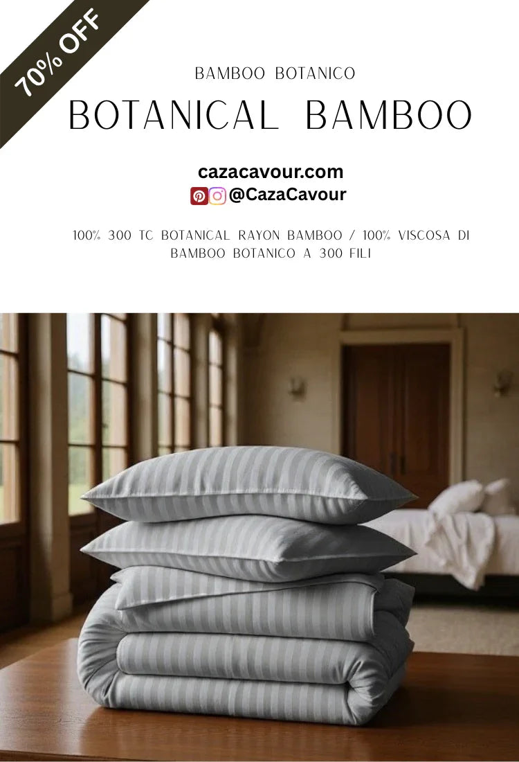 Stack of gray botanical bamboo bedding and pillows on table in sunlit bedroom, 70% off sale