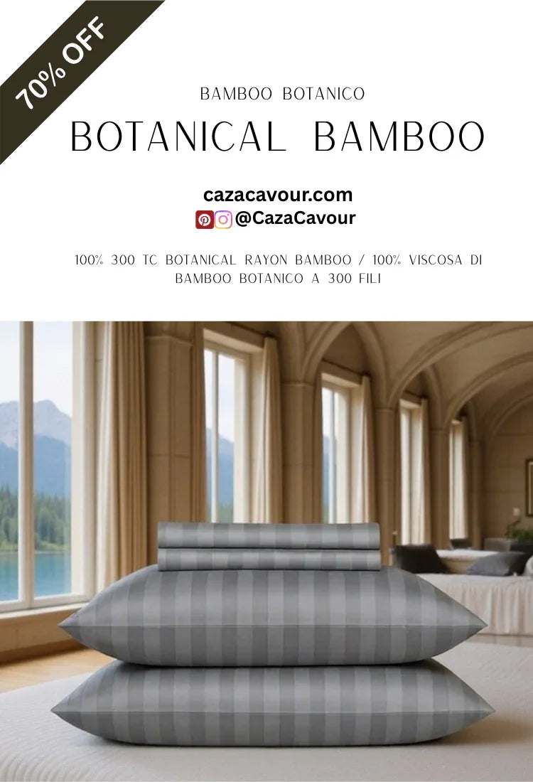 Grey botanical bamboo bedding set with striped pillowcases on bed in elegant, bright room