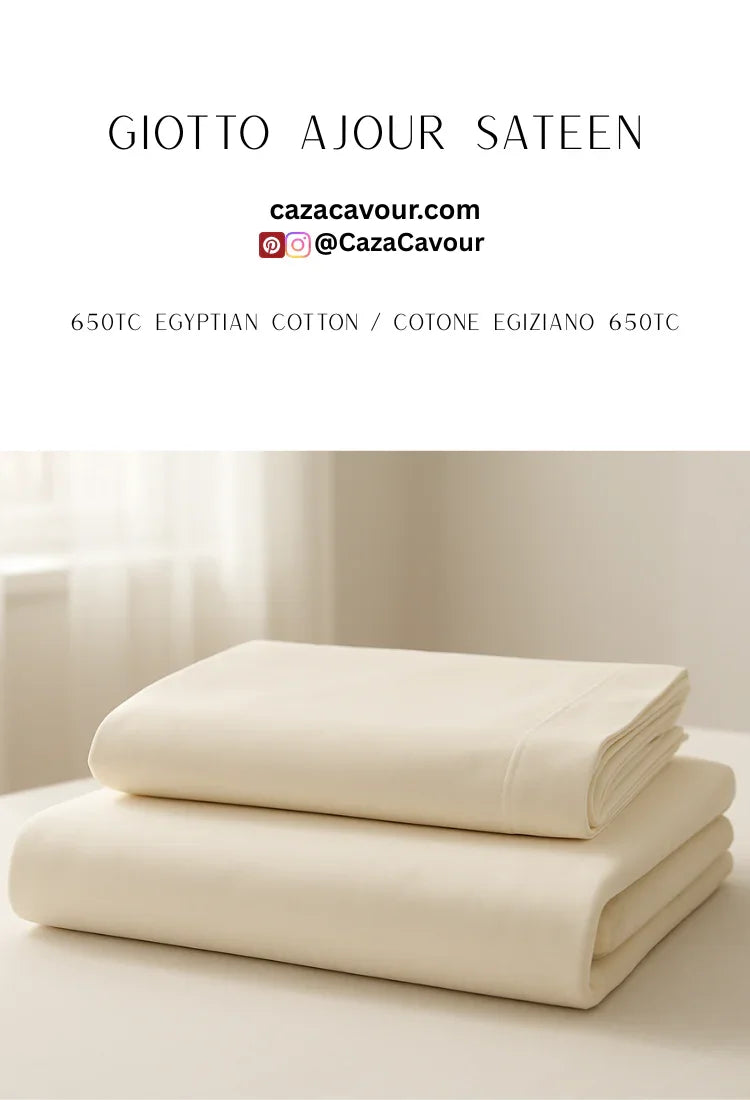 Ivory Egyptian cotton sateen sheets stacked on bed in sunlit room, 650 thread count
