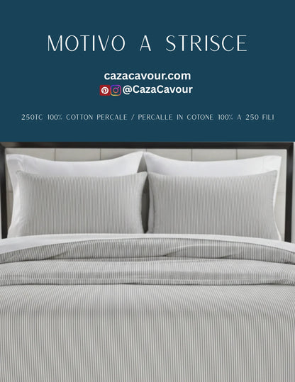 Striped cotton percale bedding set with two pillows and a comforter on a modern bed