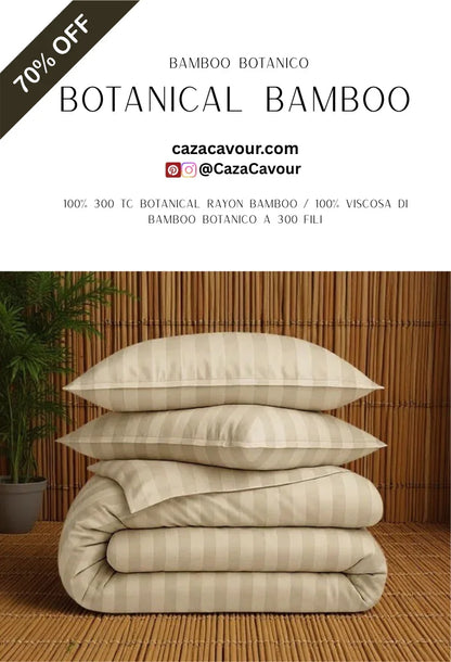 Stacked beige striped bamboo bedding set with pillows and comforter on bamboo mat with tropical plant