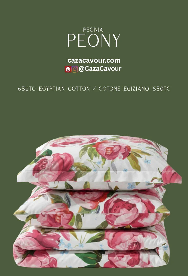 Stack of floral peony print Egyptian cotton bedding and pillowcases on green background