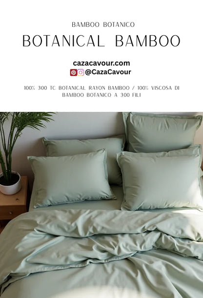 Soft green botanical bamboo bedding set with plush pillows on a neatly made bed